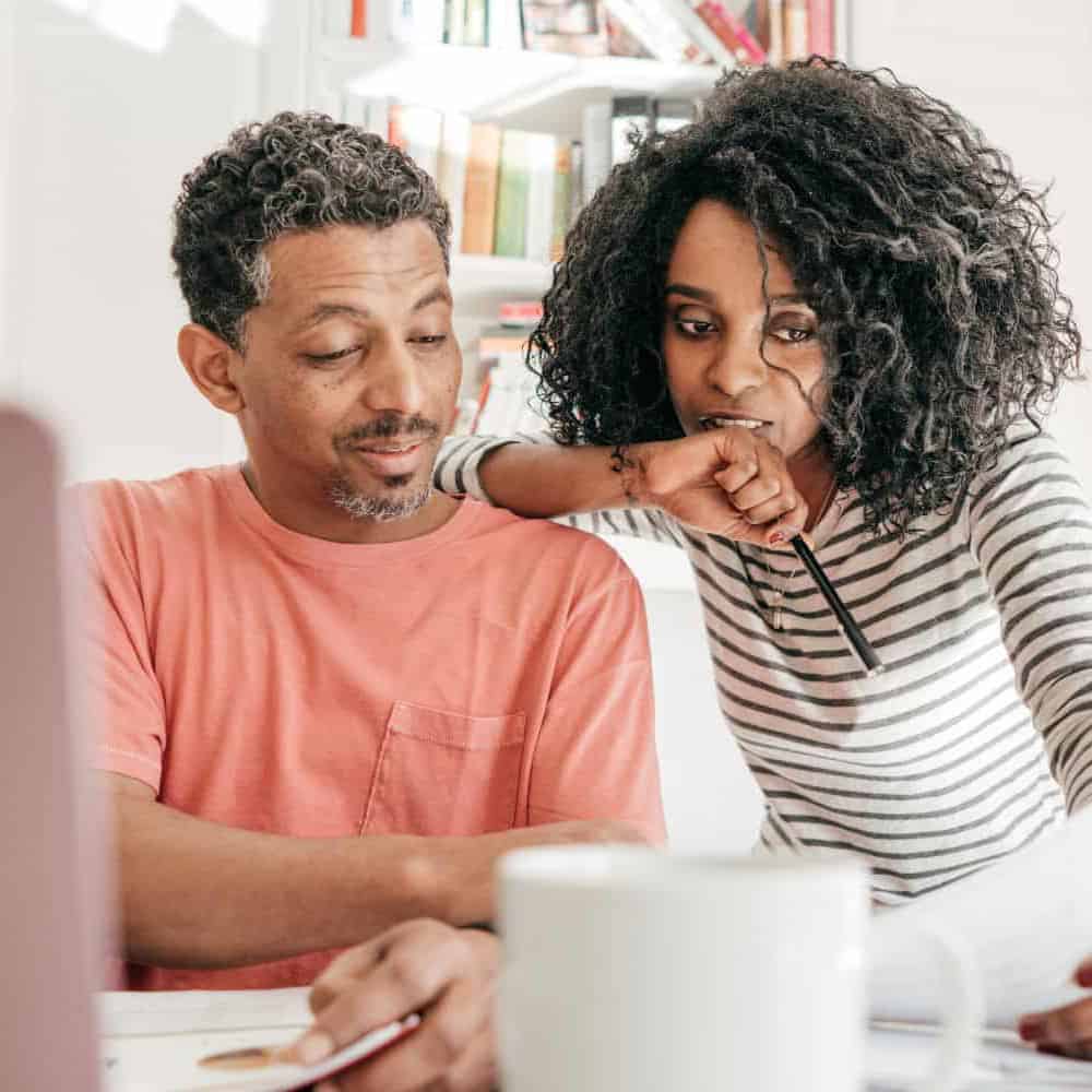 A couple reviewing paper work together